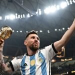 Argentina's captain and forward #10 Lionel Messi, his wife Antonela Roccuzzo and sons Thiago (C) and Ciro pose with the FIFA World Cup Trophy after Argentina won the Qatar 2022 World Cup final football match between Argentina and France at Lusail Stadium in Lusail, north of Doha on December 18, 2022. (Photo by Anne-Christine POUJOULAT / AFP)